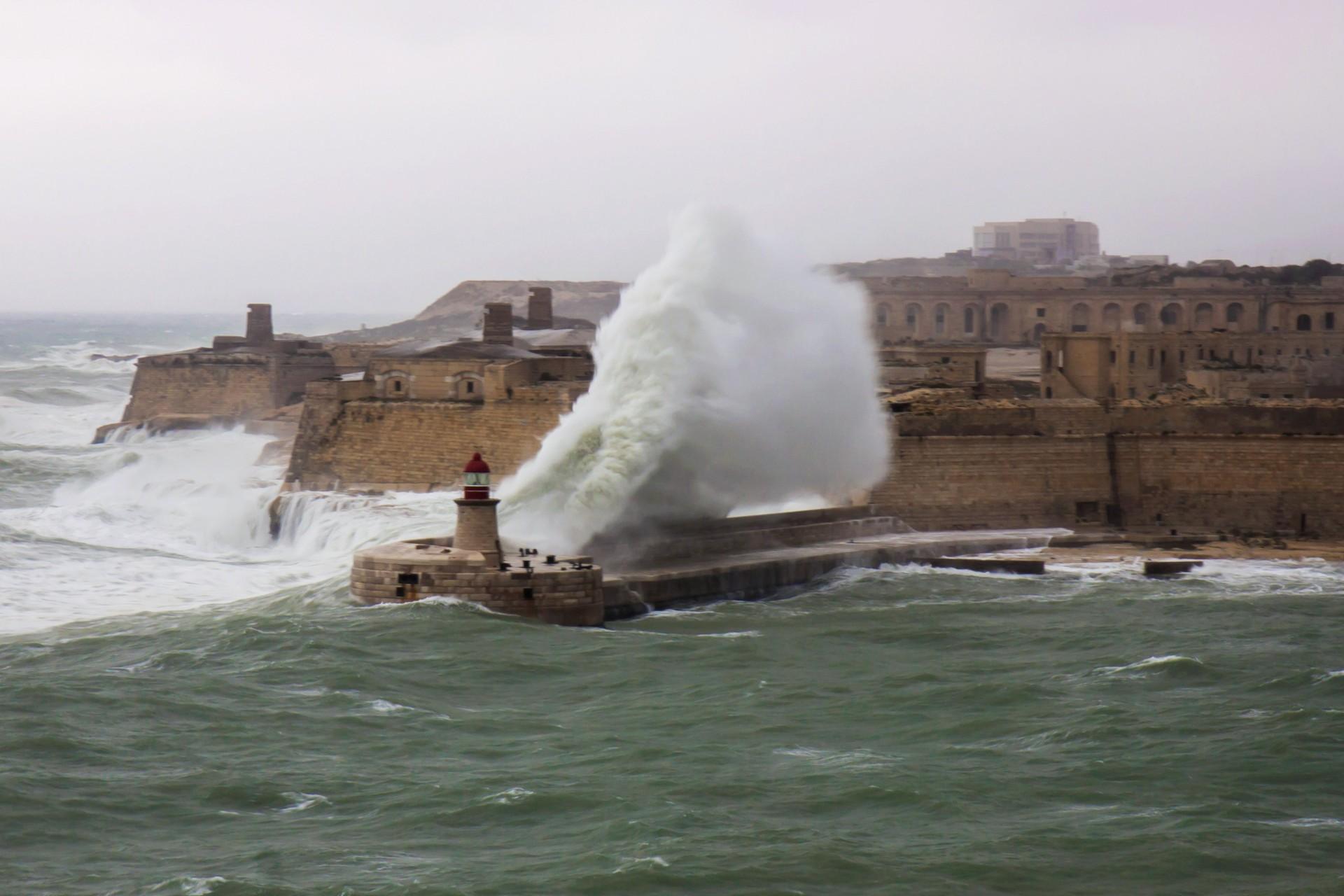 The breakwater during a heavy storm in the World Heritage city of La Valletta, Malta